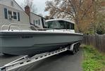 Axopar 28 CABIN - 2019 Axopar 28 CABIN boat on trailer in residential driveway.