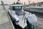 Axopar 28 CABIN - 2020 Axopar 28 CABIN boat docked with Mercury outboard engine.