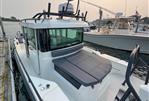 Axopar 28 CABIN - 2020 Axopar 28 CABIN boat docked in marina, featuring sleek design and spacious cabin.
