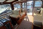 Duffy 35 Flybridge Cruiser - Interior of 1990 Duffy 35 Flybridge Cruiser with seating and nautical views.