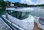 Axopar 28 CABIN - 2020 Axopar 28 CABIN boat docked by a scenic lake.
