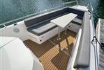 Axopar 28 CABIN - 2020 Axopar 28 CABIN boat with spacious seating and table on teak deck.