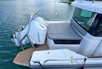 Axopar 28 CABIN - 2020 Axopar 28 CABIN boat with Mercury engine on a serene lake.