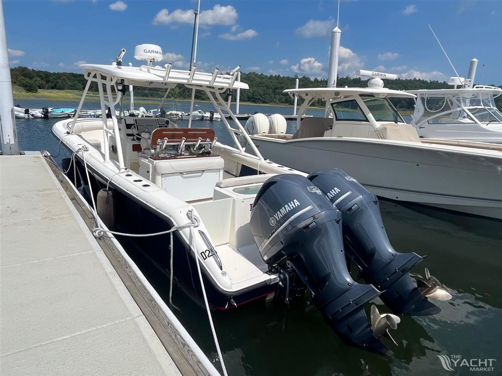 Pursuit S 280 Sport - 2011 Pursuit S 280 Sport boat docked with twin Yamaha engines.