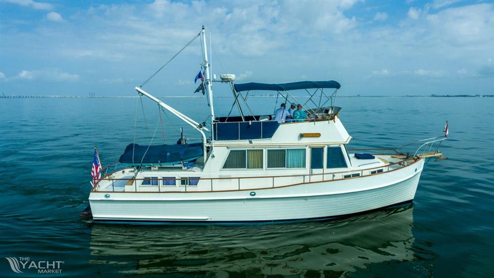 Grand Banks 42 Classic - 1985 Grand Banks 42 Classic yacht cruising on calm waters under a blue sky.