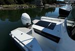 Axopar 28 CABIN - 2020 Axopar 28 CABIN boat with Mercury outboard motor on calm water.
