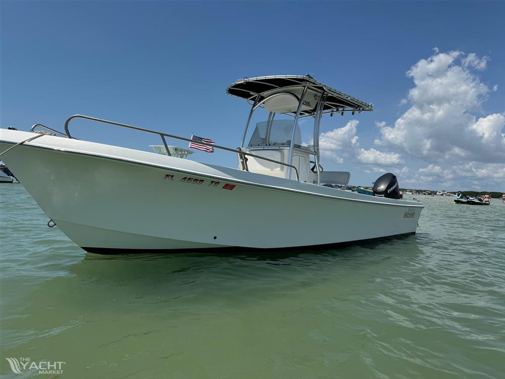 May-Craft 2300CCX - 2017 May-Craft 2300CCX boat on calm water under blue sky.