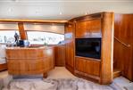 Bertram 670E - Luxurious 2004 Bertram 670E yacht interior with wood paneling and modern amenities.