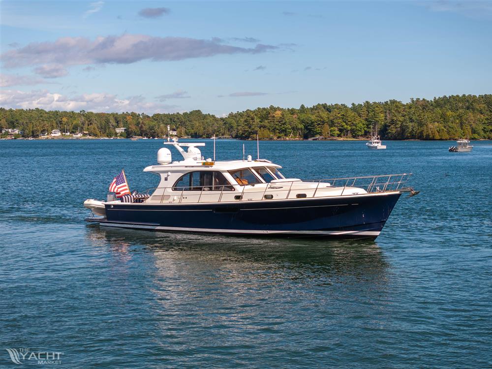 Grand Banks 50 Eastbay SX - 2014 Grand Banks 50 Eastbay SX yacht cruising on a serene lake.