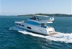 Prestige 550 - 2014 Prestige 550 yacht cruising on open water, featuring sleek design and spacious deck.