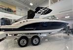 Chaparral 23 SSi OB - 2024 Chaparral 23 SSi OB boat on trailer in showroom.