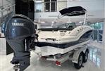 Chaparral 23 SSi OB - 2024 Chaparral 23 SSi OB boat with Yamaha outboard engine in showroom.