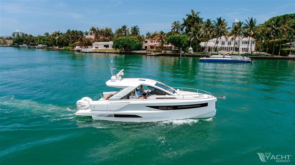 Jeanneau DB 37 OB - 2024 Jeanneau DB 37 OB cruising on a tropical waterway.