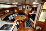 Catalina 42 - Interior of 1991 Catalina 42 sailboat with wood finish and cozy seating area.