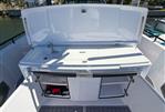 Axopar 37 Sun Top - 2022 Axopar 37 Sun Top boat with open storage compartments and sink.
