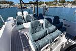 Axopar 37 Sun Top - 2022 Axopar 37 Sun Top boat interior with luxurious seating and scenic marina view.