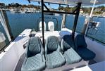 Axopar 37 Sun Top - 2022 Axopar 37 Sun Top boat with stylish seating, docked at a marina.