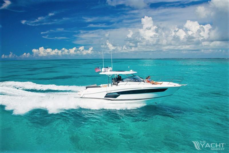 Jeanneau Leader 12.5 - 2024 Jeanneau Leader 12.5 cruising on clear turquoise waters under a bright blue sky.