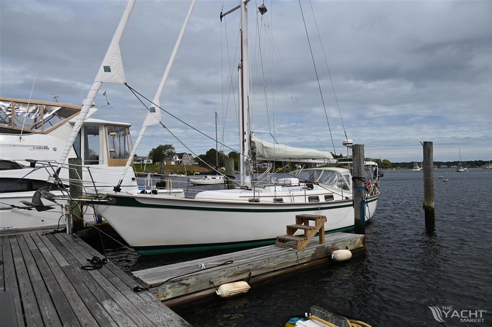 Southern Cross 39 - 1984 Southern Cross 39 sailboat docked at a marina under cloudy skies.