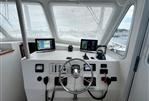 Wesmac 42 - Wesmac 42 boat helm, 2016 model, featuring navigation screens and steering wheel.