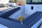 Axopar 28 CABIN - 2021 Axopar 28 CABIN boat interior with seating and coiled yellow cable.