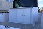 Axopar 28 CABIN - 2021 Axopar 28 CABIN boat deck with storage compartment.