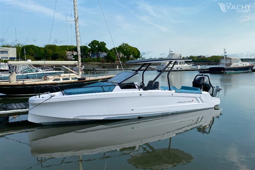 Axopar 25 Cross Top - 2022 Axopar 25 Cross Top boat docked in a serene marina setting.