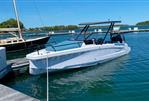 Axopar 25 Cross Top - 2022 Axopar 25 Cross Top boat docked in a marina, clear blue water.
