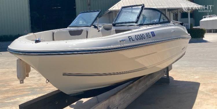 Bayliner VR4 - 2018 Bayliner VR4 boat on trailer, parked outdoors in sunny setting.