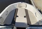 Bayliner VR4 - 2018 Bayliner VR4 boat interior with cushioned seating and sleek design.