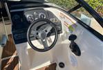 Bayliner VR4 - 2018 Bayliner VR4 boat dashboard with steering wheel and control panel.