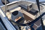 Bayliner VR4 - 2018 Bayliner VR4 boat interior with seating and Mercury engine.
