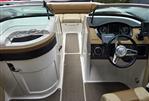 Sea Ray 220 Sundeck - 2015 Sea Ray 220 Sundeck interior with steering wheel and seating area.