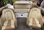 Sea Ray 220 Sundeck - 2015 Sea Ray 220 Sundeck interior with beige and brown seating, featuring quilted design.