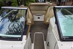 Sea Ray 220 Sundeck - 2015 Sea Ray 220 Sundeck interior with tan seating and dual windshields.