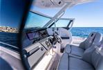 Axopar 29 Suntop - 2025 Axopar 29 Suntop interior with modern dashboard and ocean view.