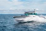 Axopar 29 Cross Cabin - 2025 Axopar 29 Cross Cabin boat cruising on open water.