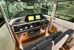 Axopar 28 CABIN - 2021 Axopar 28 CABIN interior with modern dashboard and navigation equipment.