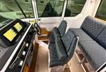 Axopar 28 CABIN - Interior of 2021 Axopar 28 CABIN boat with modern dashboard and seating.