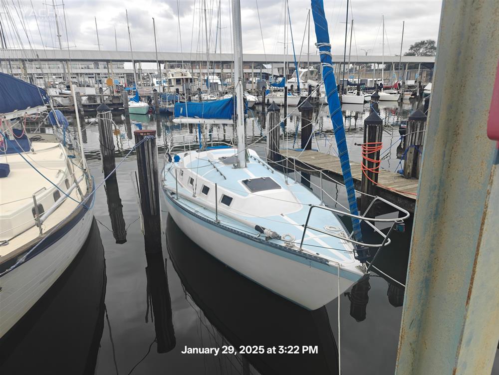 Lancer Yachts 30 Sloop - 1979 Lancer Yachts 30 Sloop docked at marina, overcast sky.
