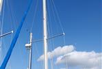 Lancer Yachts 30 Sloop - Masts of a 1979 Lancer Yachts 30 Sloop against a clear blue sky.