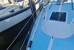 Lancer Yachts 30 Sloop - 1979 Lancer Yachts 30 Sloop docked at marina, blue deck, sailboats nearby.