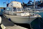 Corvette Sea Coral - 1993 Corvette Sea Coral boat docked at marina, featuring classic design and spacious cabin.