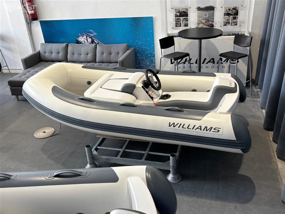 Williams Jet Tenders MiniJet 280 - 2022 Williams Jet Tenders MiniJet 280 on display in showroom with seating area.