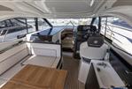 Jeanneau Leader 33 - Interior of 2021 Jeanneau Leader 33 yacht with seating, helm, and sink.