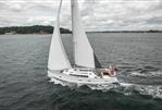 Bavaria Cruiser 51 - 2016 Bavaria Cruiser 51 sailing on open water under cloudy skies.