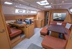Bavaria Cruiser 51 - Interior of 2016 Bavaria Cruiser 51 yacht with modern kitchen and seating area.