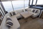 Absolute 52 Navetta - Luxurious interior of 2021 Absolute 52 Navetta yacht with cozy seating and ocean view.