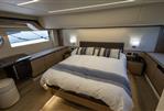 Absolute 52 Navetta - Luxurious bedroom interior of 2021 Absolute 52 Navetta yacht, featuring elegant design and modern amenities.