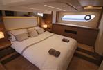 Prestige 460 - Luxurious bedroom interior of 2019 Prestige 460 yacht with modern design and elegant furnishings.